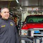 Scappoose Fire District Chief Jeff Pricher stands in the bay of the fire station on Highway 30.