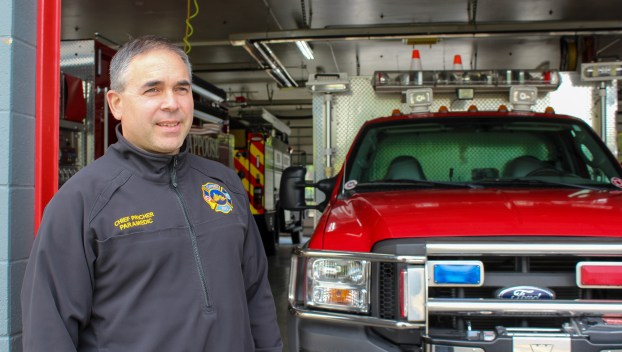 Scappoose Fire District Chief Jeff Pricher stands in the bay of the fire station on Highway 30.