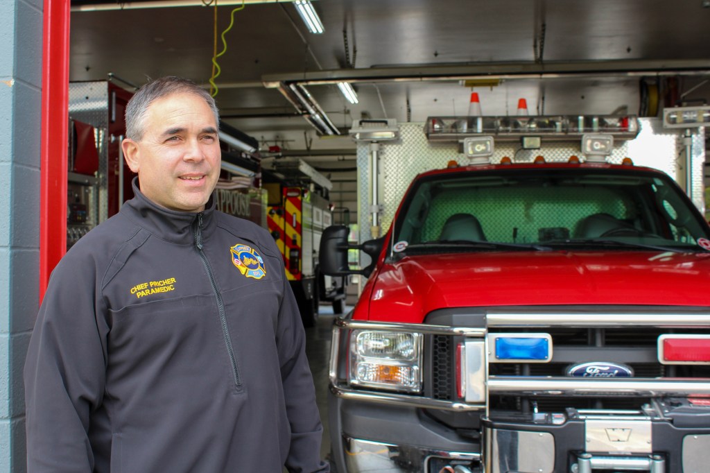 Scappoose Fire District Chief Jeff Pricher stands in the bay of the fire station on Highway 30.